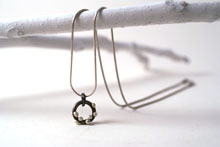 small silver on steel pendant