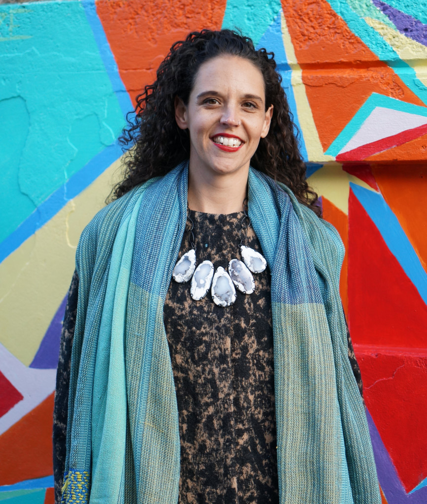 street style portrait: scarf and statement necklace over patterned coat