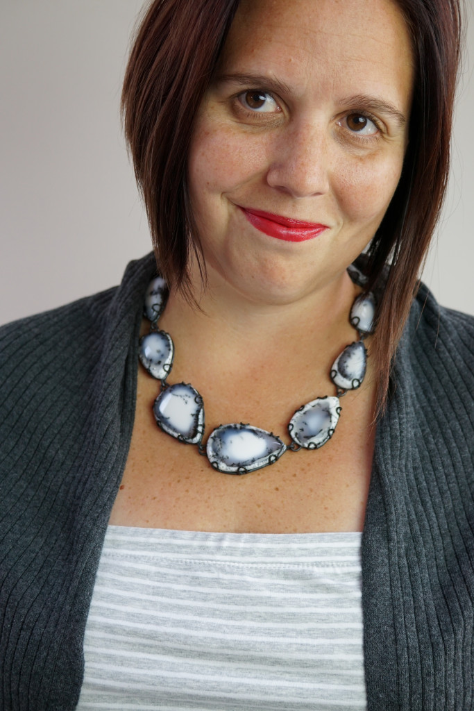 elegant casual style: black and white gemstone necklace with strapless dress and cardigan