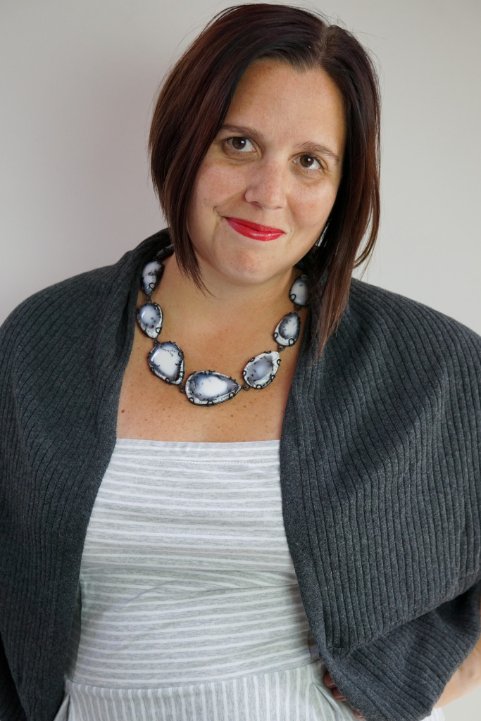 black and white gemstone necklace with grey and white dress and cardigan