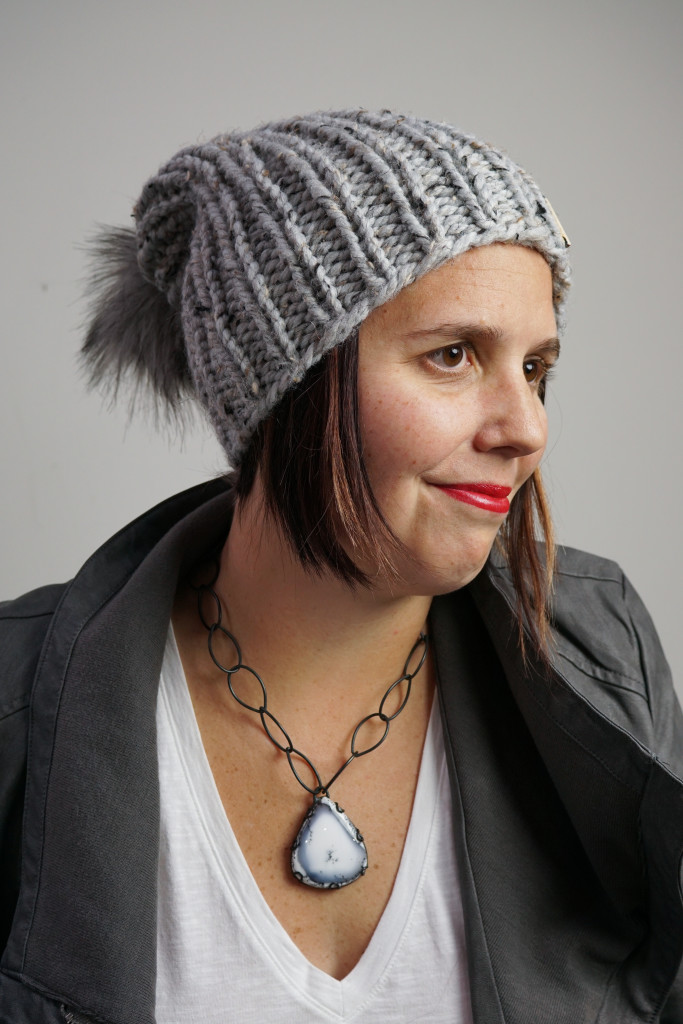 edgy and sweet winter style: knit hat, faux leather jacket, chunky amulet necklace