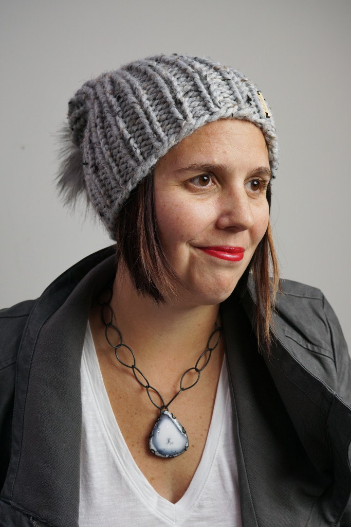 edgy and sweet winter style: knit hat, faux leather jacket, chunky amulet necklace