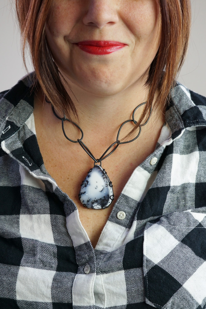 what necklace to wear with a plaid flannel shirt: chunky black and white chain link gemstone necklace