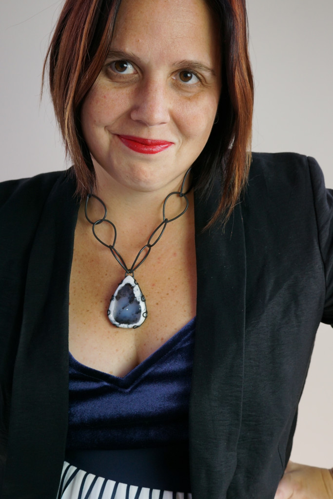 holiday party outfit: navy and black with one of a kind gemstone necklace