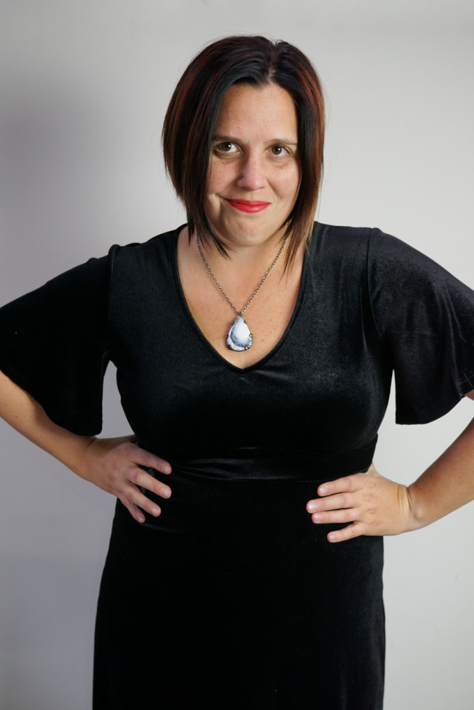 holiday party outfit: velvet little black dress and gemstone pendant necklace