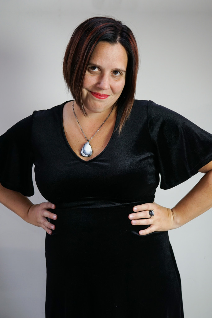 holiday party outfit: velvet little black dress and gemstone pendant necklace