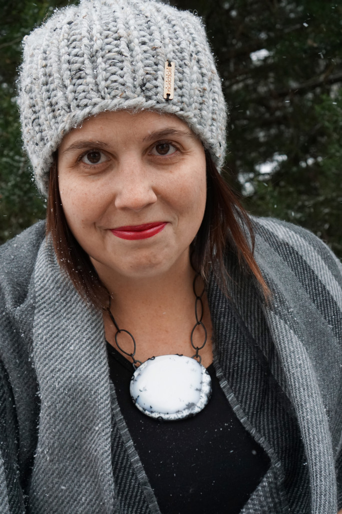 winter style: snowy winter portrait with black and white statement necklace