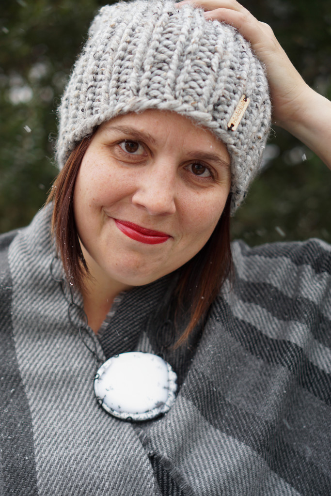 winter style: snowy winter portrait with black and white statement necklace
