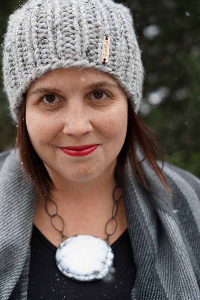 winter style: snowy winter portrait with black and white statement necklace