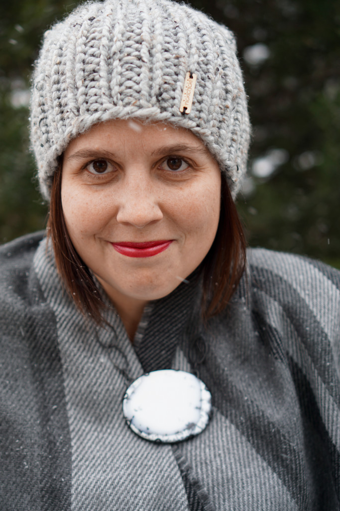 winter style: snowy winter portrait with black and white statement necklace