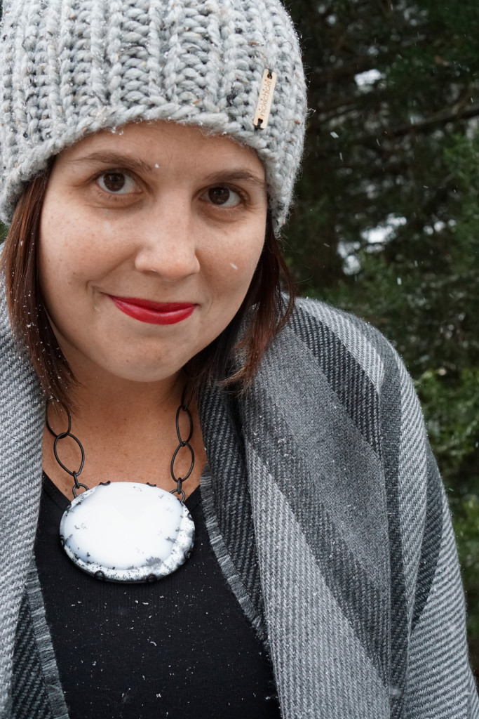 winter style: snowy winter portrait with black and white statement necklace