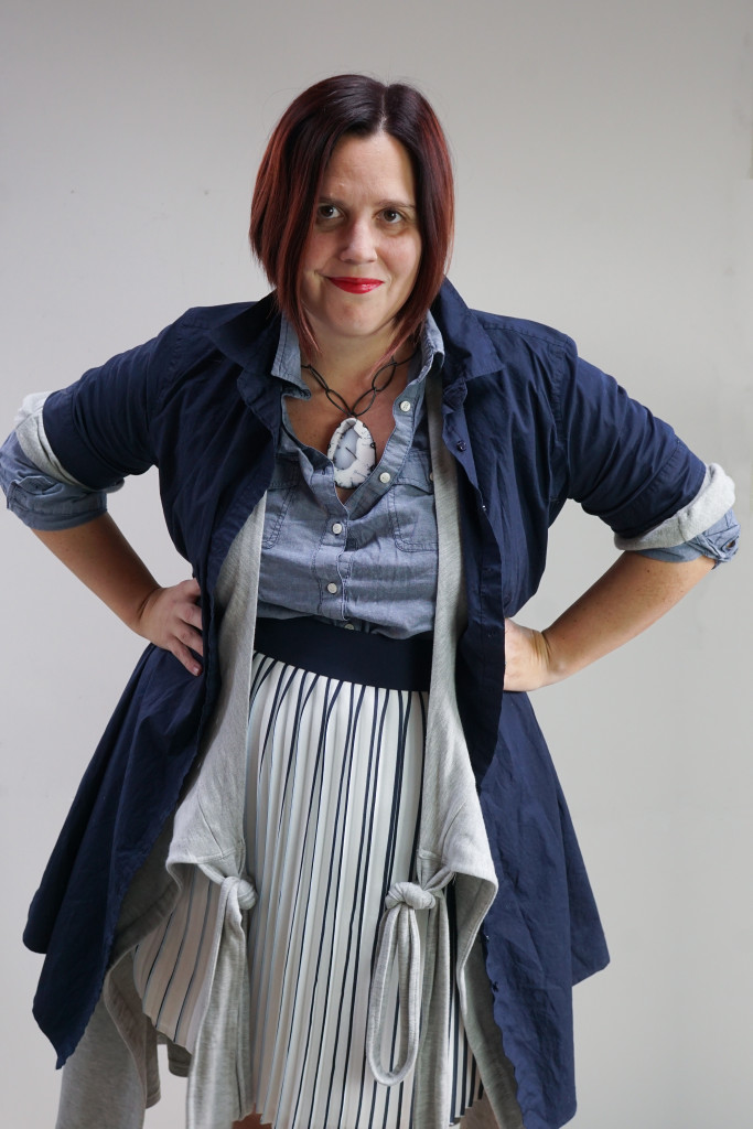 one dress thirty ways challenge, creative layering: shirt dress and wrap dress over pleated skirt and chambray shirt with bold gemstone necklace