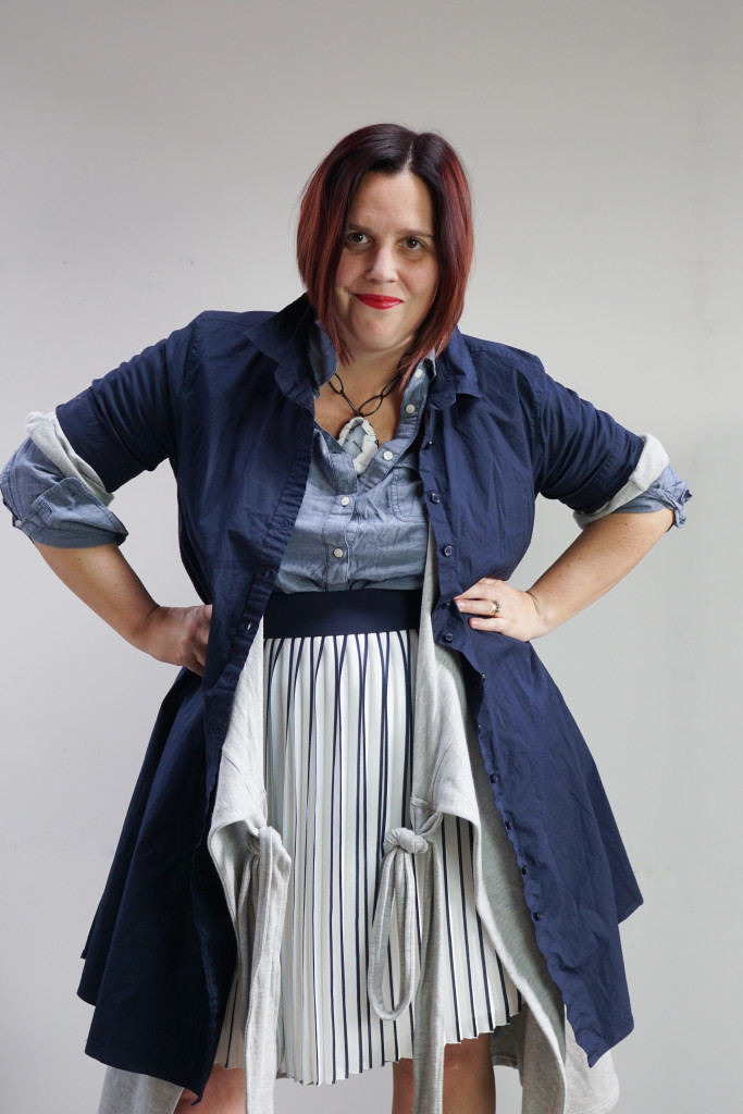 one dress thirty ways challenge, creative layering: shirt dress and wrap dress over pleated skirt and chambray shirt with bold gemstone necklace