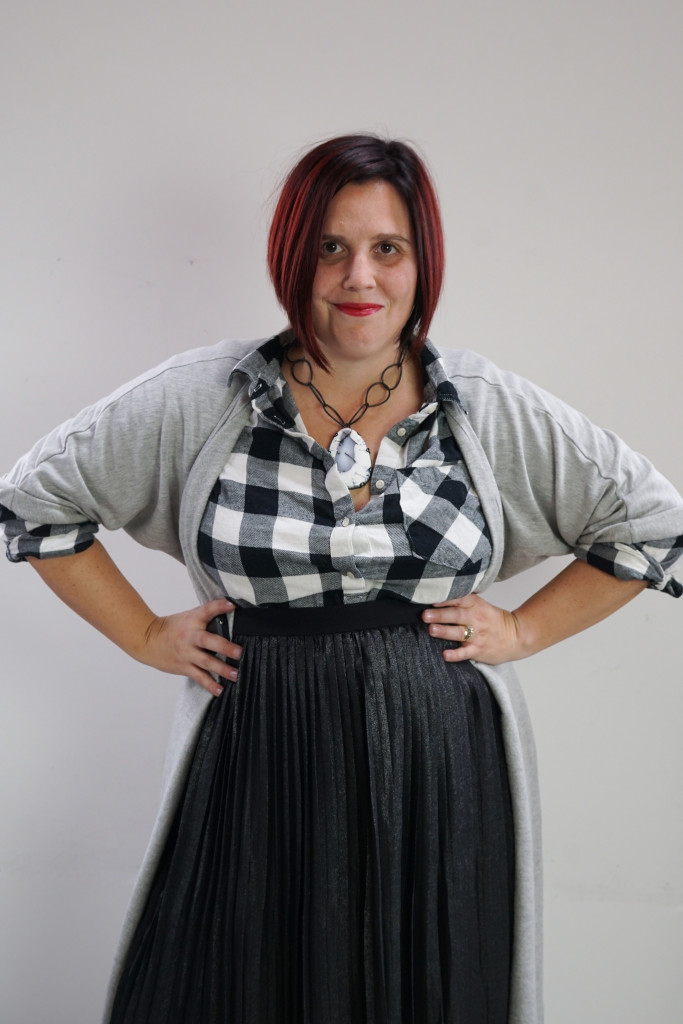 one dress, thirty ways creative style outfit inspiration: grey wrap dress as duster over black and white plaid shirt and black pleated skirt with giant gemstone statement necklace