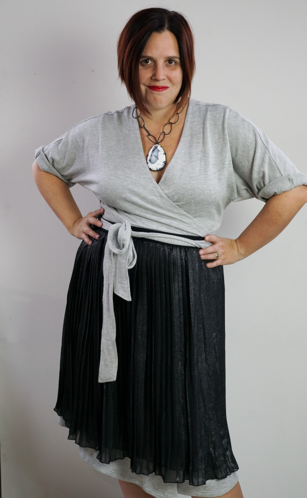 one dress, thirty ways style inspiration: inspired by late 50s, early 60s movie style: grey wrap dress, black pleated skirt, and chunky gemstone statement necklace (for a touch of attitude)