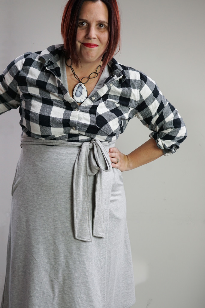 bold comfortable style: sweatshirt wrap dress, buffalo plaid flannel shirt, and chunky gemstone necklace