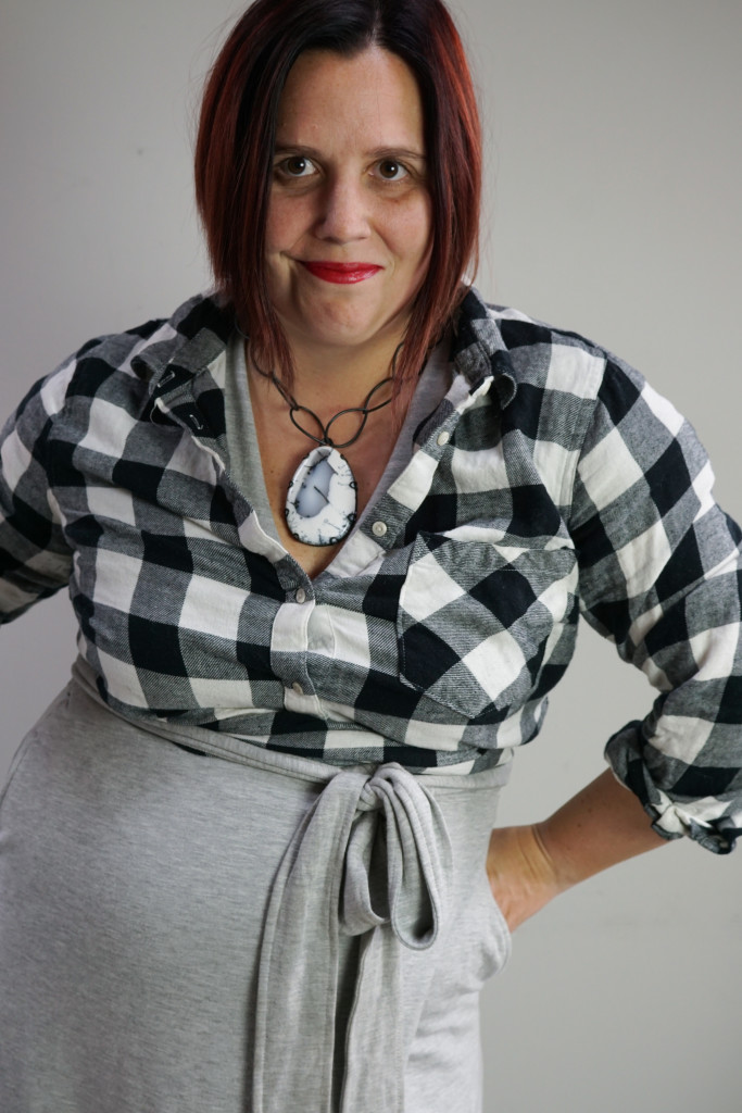 bold comfortable style: sweatshirt wrap dress, buffalo plaid flannel shirt, and chunky gemstone necklace