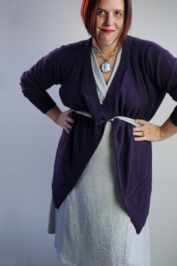 one dress, thirty ways outfit inspiration: grey wrap dress with purple cardigan and chunky gemstone necklace