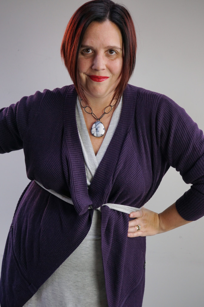 one dress, thirty ways outfit inspiration: grey wrap dress with purple cardigan and chunky gemstone necklace