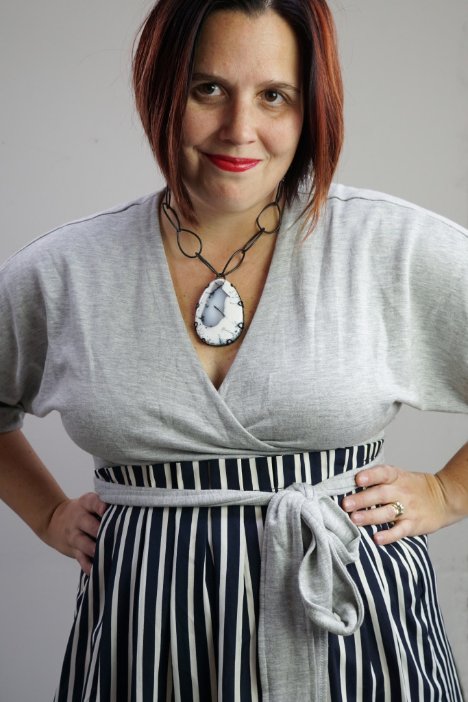 one dress, thirty ways style challenge: grey wrap dress with striped midi skirt and chunky gemstone necklace