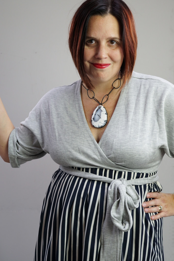 one dress, thirty ways style challenge: grey wrap dress with striped midi skirt and chunky gemstone necklace