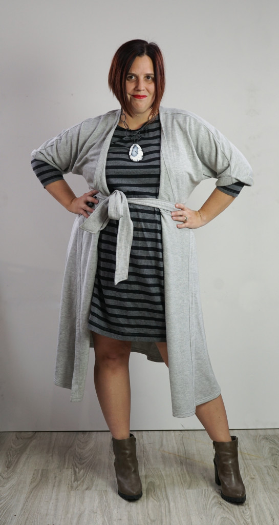 one dress thirty ways style challenge: grey wrap dress over grey and black striped dress with chunky gemstone statement necklace