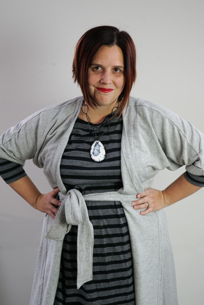 one dress thirty ways style challenge: grey wrap dress over grey and black striped dress with chunky gemstone statement necklace