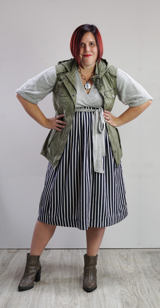 one dress challenge, creative outfit ideas: military vest over wrap dress and striped skirt with chunky gemstone necklace