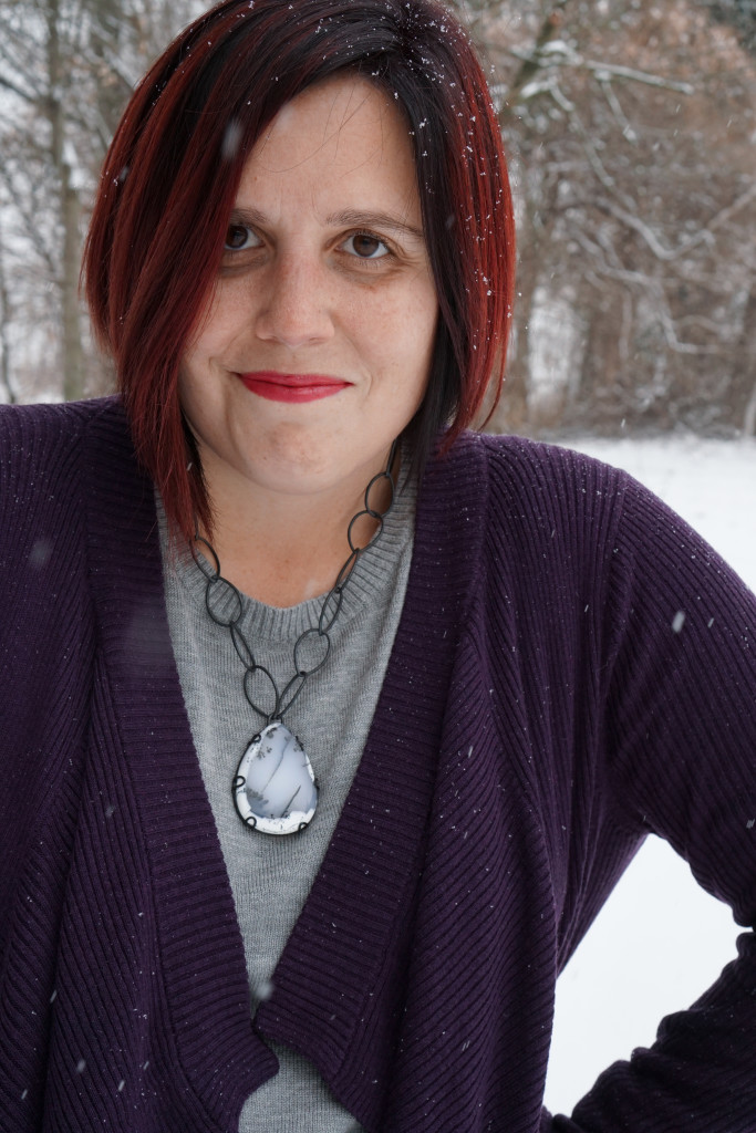 casual winter style: layered sweaters and chunky gemstone statement necklace