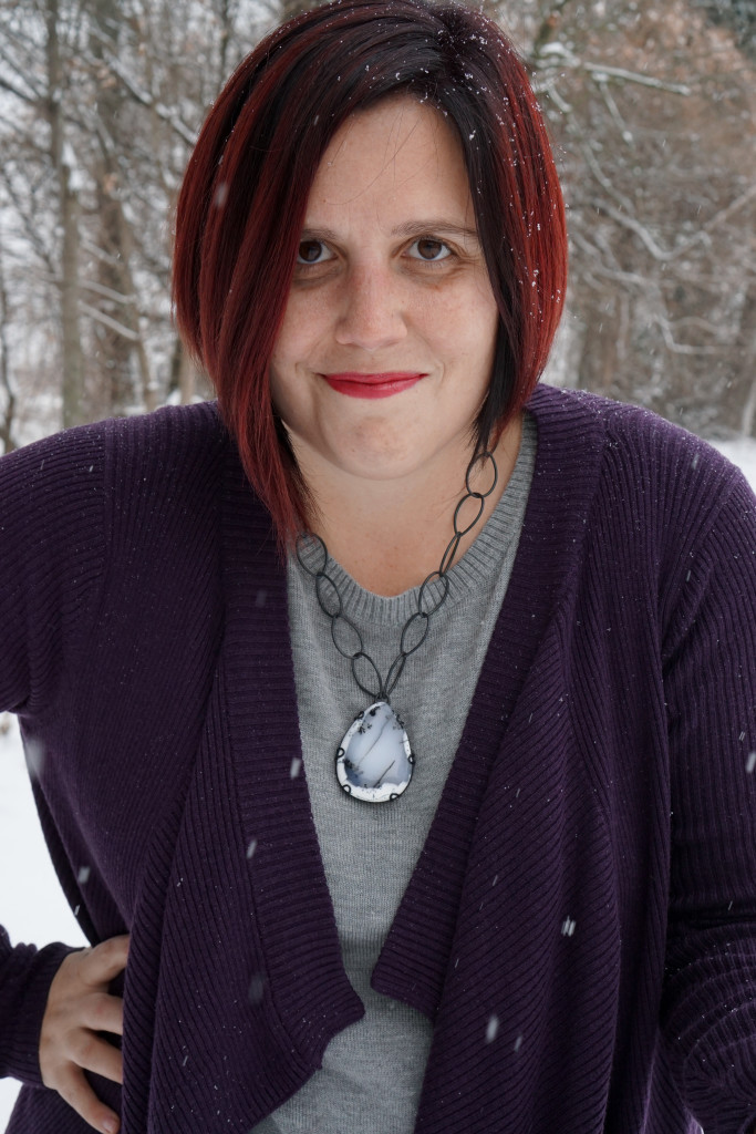 casual winter style: layered sweaters and chunky gemstone statement necklace