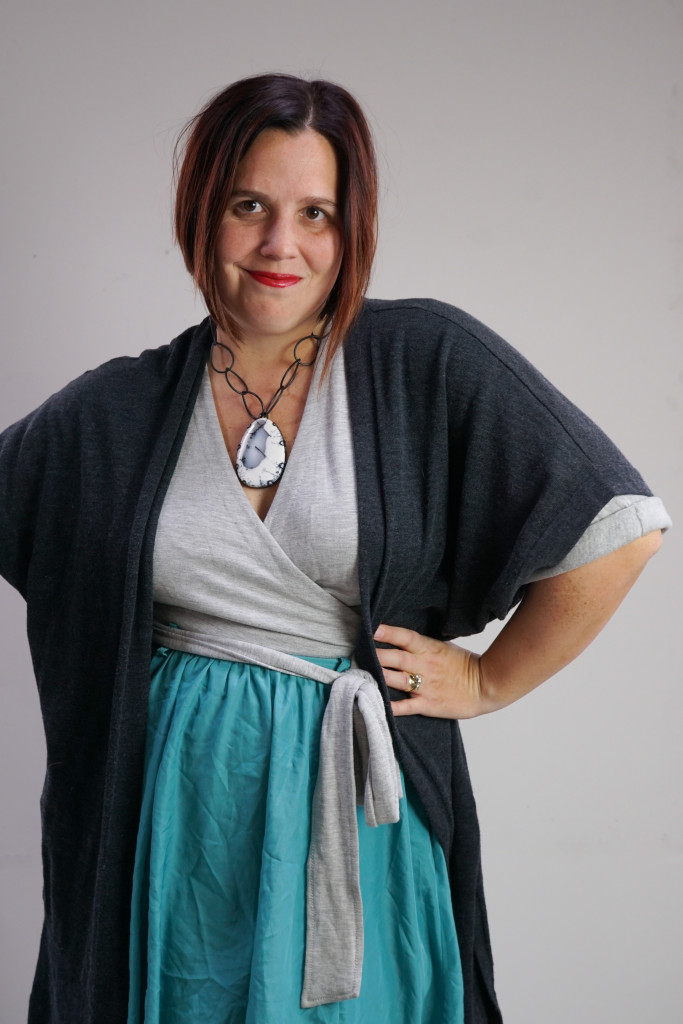 one dress, thirty ways style inspiration: playing with layers with a grey wrap dress, aqua skirt, charcoal cardigan, and chunky gemstone statement necklace