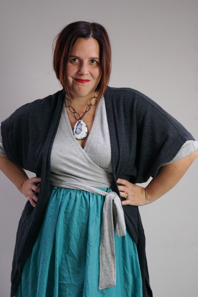 one dress, thirty ways style inspiration: playing with layers with a grey wrap dress, aqua skirt, charcoal cardigan, and chunky gemstone statement necklace