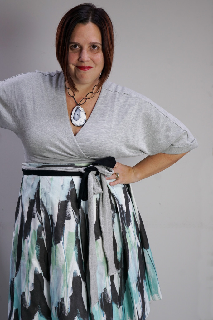 one dress, thirty ways - creative style outfit inspiration: a styling trick to wear a patterned pleated wrap skirt over a wrap dress