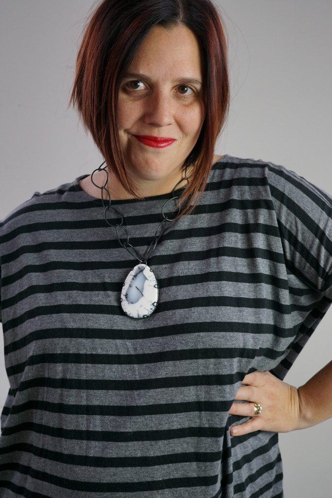 one dress, three necklaces: chunky gemstone necklace with oversized grey and black striped dress