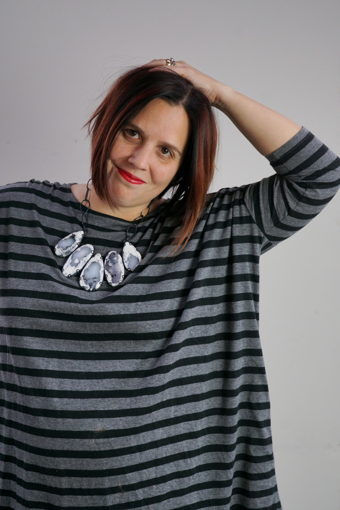 one dress, three necklaces: chunky gemstone necklace with oversized grey and black striped dress