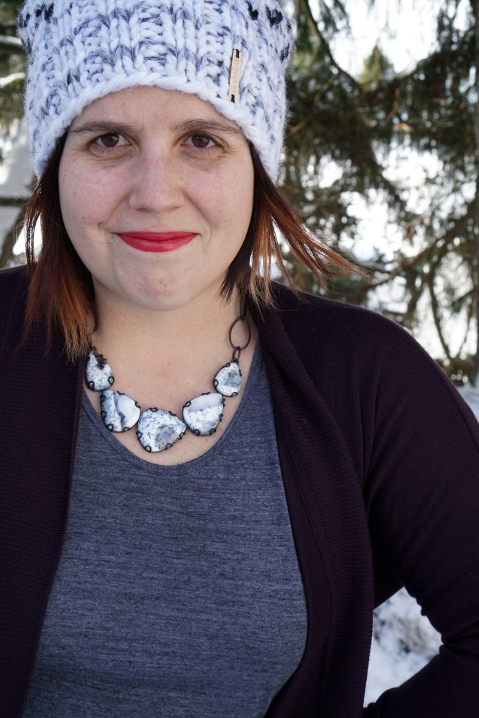 black and white statement necklace with cozy cardigan and knit hat