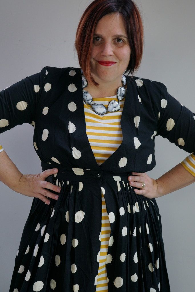 creative outfit inspiration, one dress, thirty ways: black and white maxi shirt dress over yellow striped midi dress with statement necklace