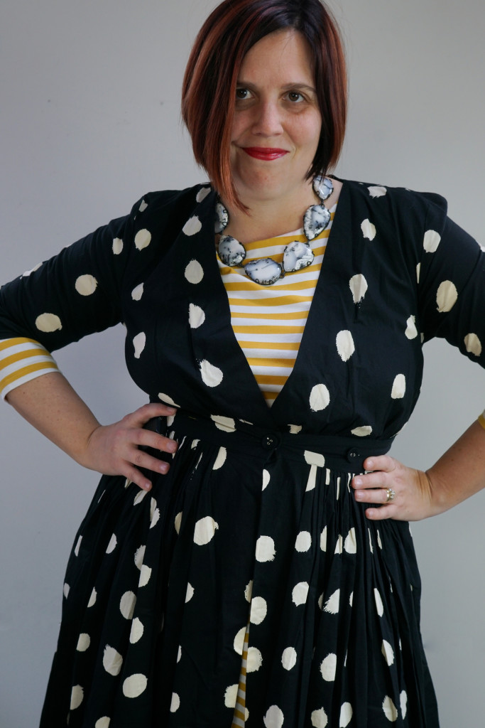 creative outfit inspiration, one dress, thirty ways: black and white maxi shirt dress over yellow striped midi dress with statement necklace