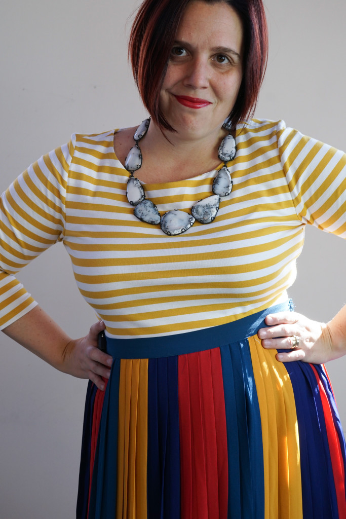 outfit inspiration: one dress, thirty ways: striped midi skirt over striped dress with statement necklace