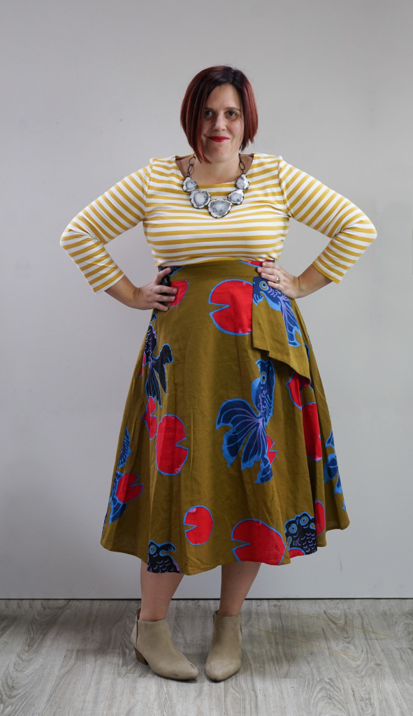 outfit inspiration, one dress, thirty ways: printed anthropologie midi skirt over striped dress with statement necklace