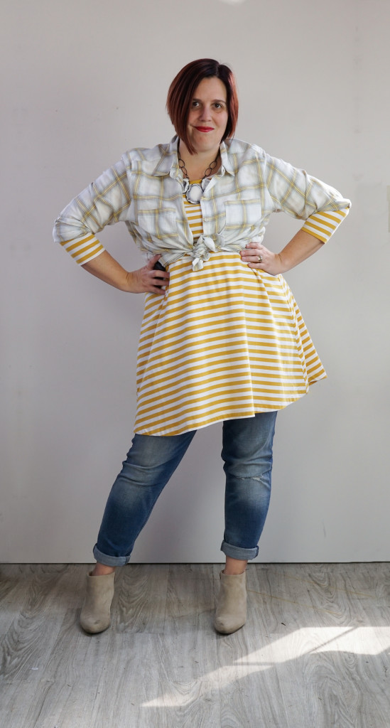 creative outfit ideas: plaid shirt and striped dress over jeans