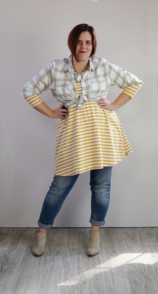 creative outfit ideas: plaid shirt and striped dress over jeans