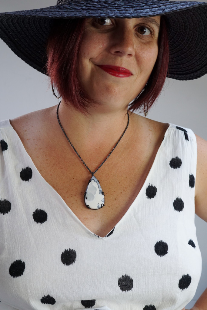 black and white summer style: straw hat, statement earrings, gemstone necklace, ikat polka dot dress