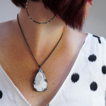 black and white summer style: statement earrings, gemstone necklace, and ikat dress
