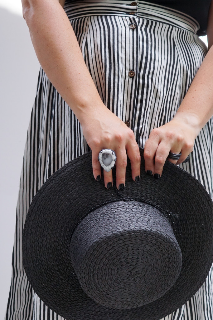 black and white summer style: striped skirt, straw hat, and statement ring