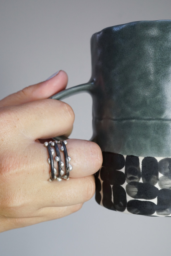 silver on steel stacking rings and handmade ceramic mug