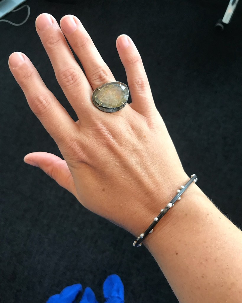 mixed metal handmade jewelry: silver on steel bracelet by megan auman and rutilated quartz ring by chikahisa studio