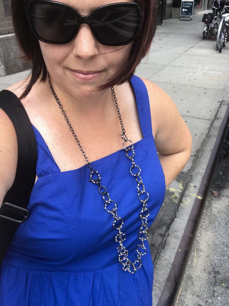 long silver on steel handcrafted necklace worn by metalsmith megan auman on the streets of New York City