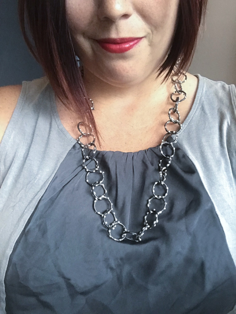 long silver on steel handcrafted necklace worn by metalsmith megan auman