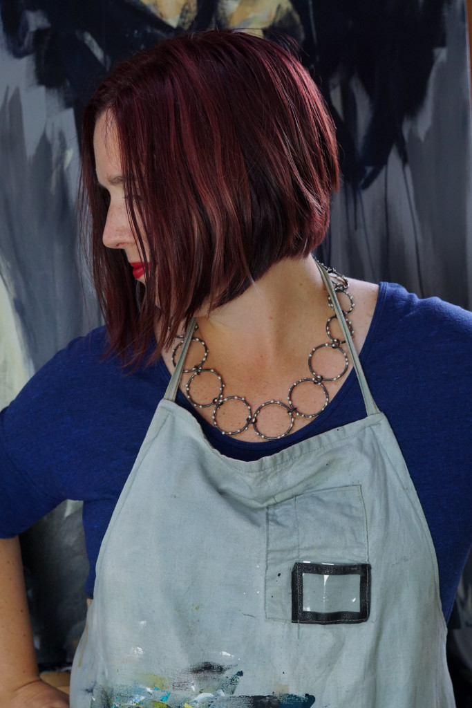 artist studio style: wearing a handcrafted statement necklace with my painting apron